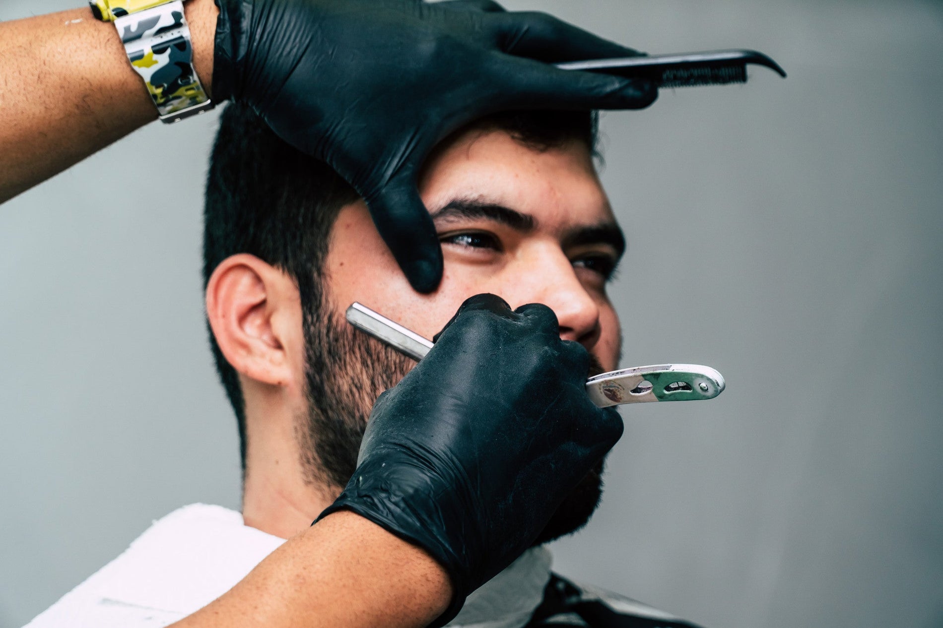 Canva - Person Shaving a Man's Face With Straight Razor